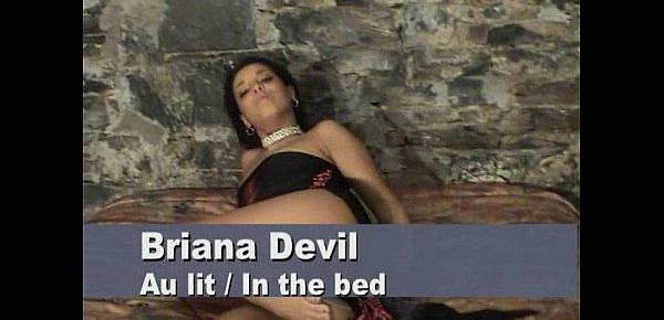  Briana Devil a teen brunette pleasing herself in her bed room